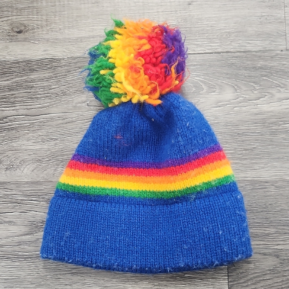 The Mountain Lid Blue and Rainbow Knit Hat with Pom-Pom